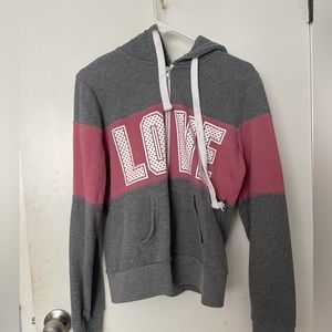 Pink and grey zip up. LOVE spelled across the chest